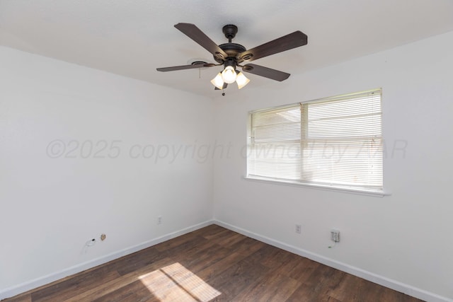 unfurnished room featuring baseboards, dark wood-style flooring, and ceiling fan