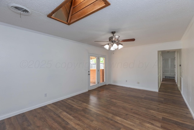 empty room with ornamental molding, dark wood-style flooring, ceiling fan, baseboards, and a textured ceiling