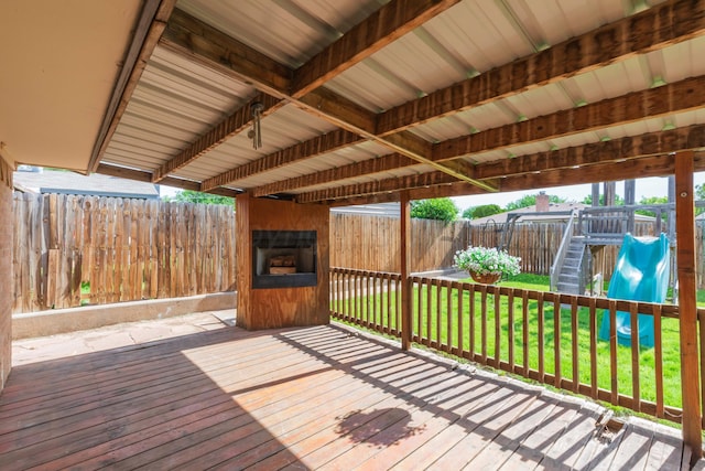 wooden terrace with a playground