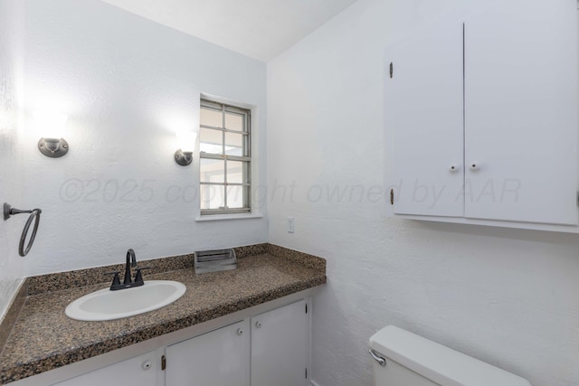 half bath with toilet and vanity
