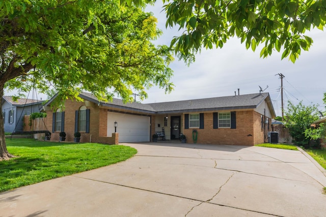 ranch-style home featuring brick siding, driveway, a garage, and central AC unit