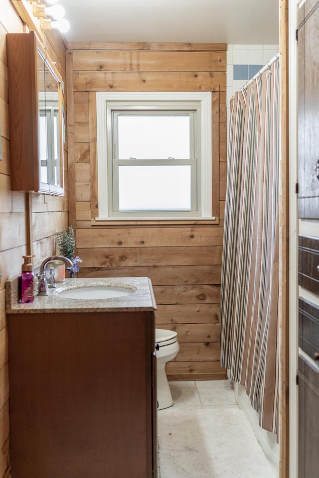1002 S Main St, Wheeler, TX 79096 - bathroom with vanity, wooden walls, and a shower with curtain