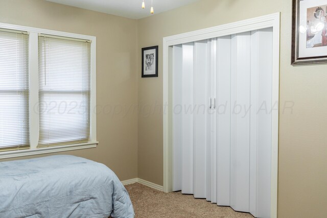 1002 S Main St, Wheeler, TX 79096 - bedroom with light colored carpet and a closet