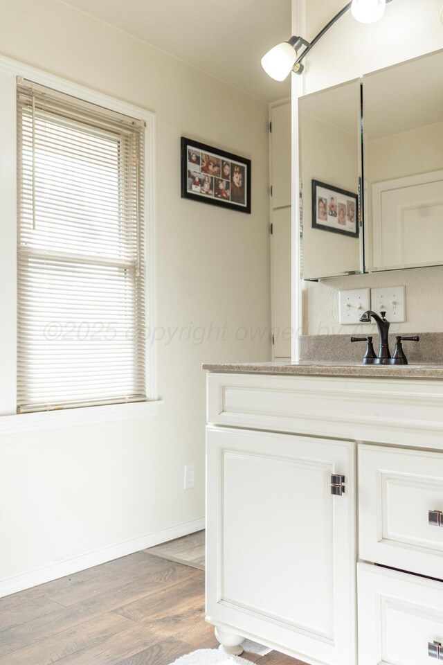 1002 S Main St, Wheeler, TX 79096 - bathroom with vanity and wood finished floors