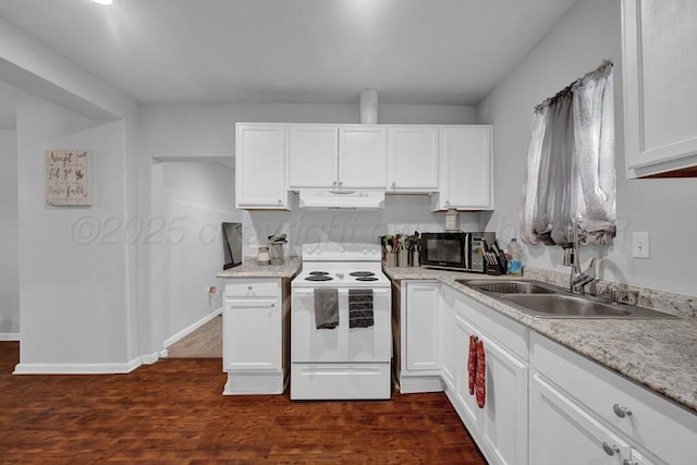 307 N Georgia St, Amarillo, TX 79106 - kitchen featuring electric range, under cabinet range hood, black microwave, a sink, and white cabinetry