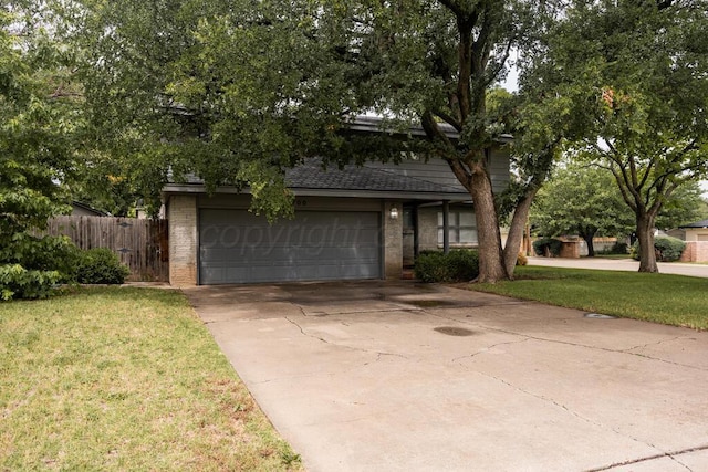 3700 Paramount Blvd, Amarillo, TX 79109 - obstructed view of property featuring brick siding, concrete driveway, and roof with shingles