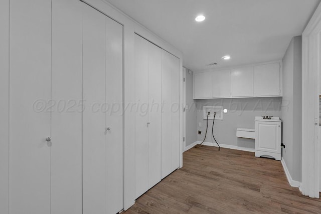 3700 Paramount Blvd, Amarillo, TX 79109 - laundry room with recessed lighting and wood finished floors