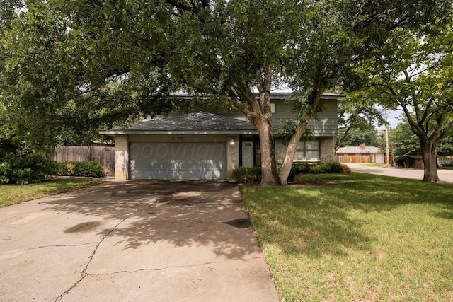 3700 Paramount Blvd, Amarillo, TX 79109 - view of front of house featuring an attached garage, driveway, and brick siding
