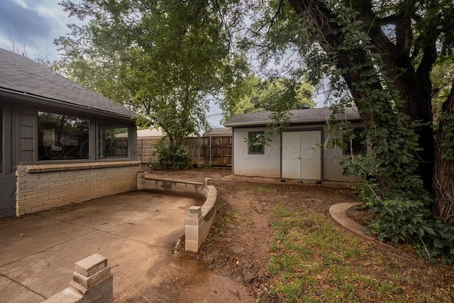 3700 Paramount Blvd, Amarillo, TX 79109 - view of yard featuring an outdoor structure and a patio area