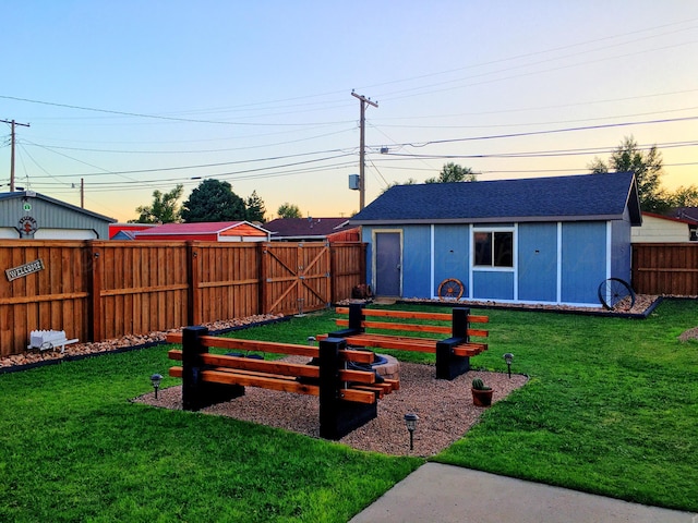 yard at dusk with an outbuilding