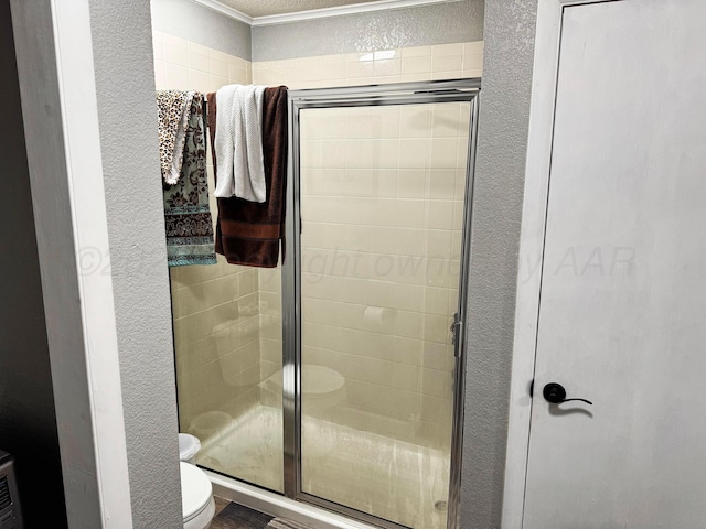 bathroom with toilet and walk in shower