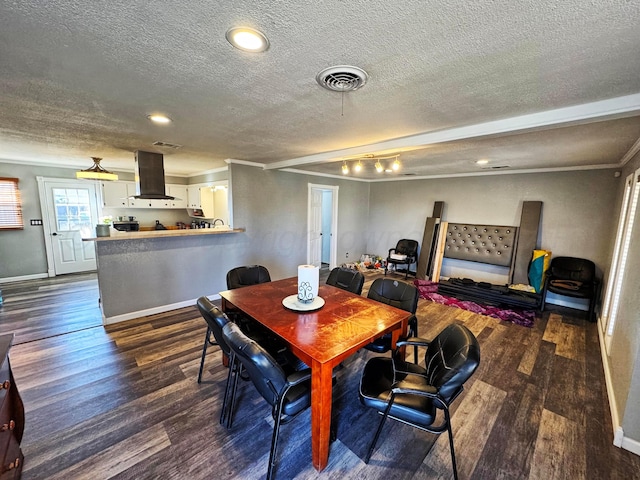 dining space featuring crown molding, dark hardwood / wood-style flooring, and a textured ceiling