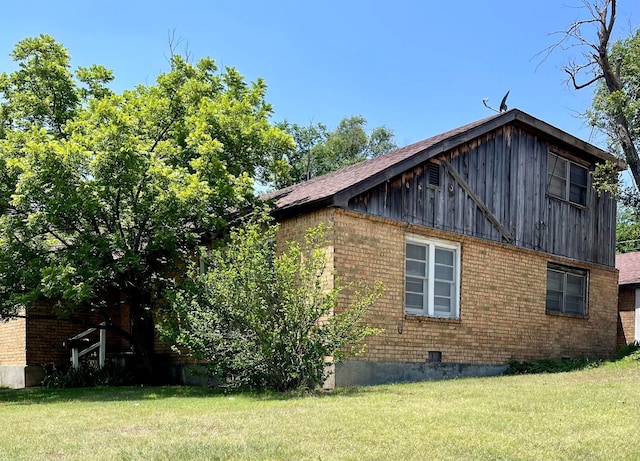 view of home's exterior featuring a lawn