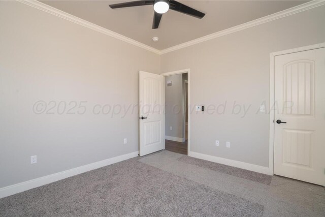 719 Prairie Ave, Dumas, TX 79029 - unfurnished bedroom with crown molding, carpet floors, baseboards, and a ceiling fan
