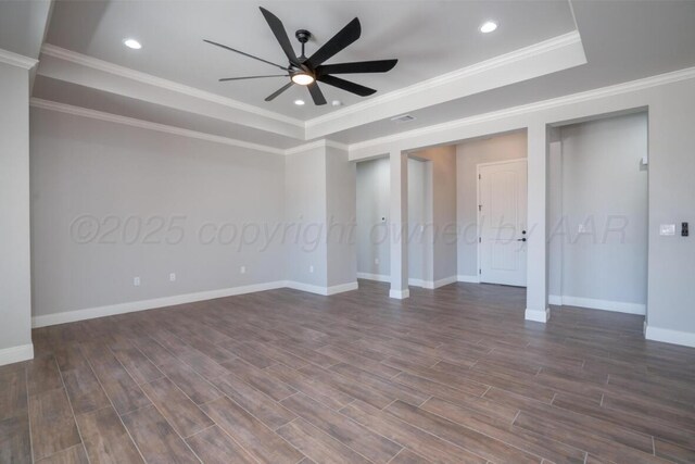 719 Prairie Ave, Dumas, TX 79029 - spare room with a raised ceiling, a ceiling fan, dark wood finished floors, baseboards, and recessed lighting