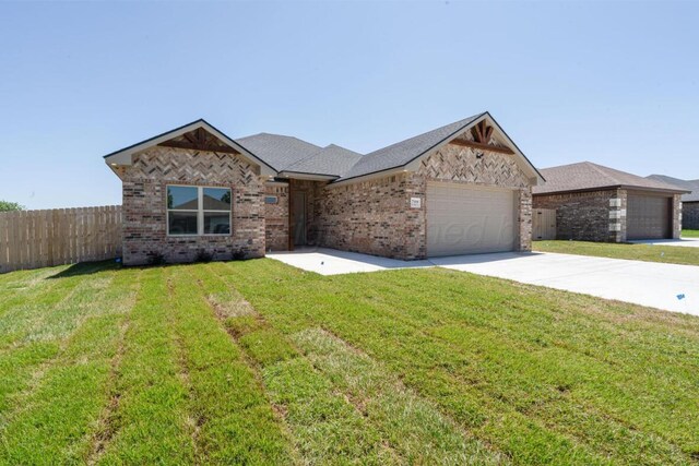 719 Prairie Ave, Dumas, TX 79029 - ranch-style house featuring an attached garage, concrete driveway, and brick siding