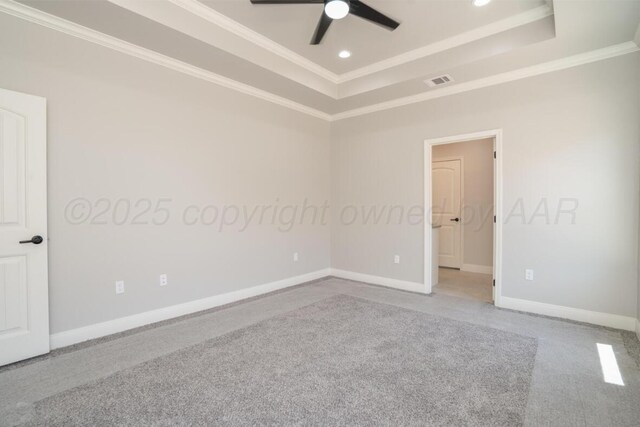 719 Prairie Ave, Dumas, TX 79029 - carpeted spare room featuring a tray ceiling, a ceiling fan, ornamental molding, baseboards, and recessed lighting