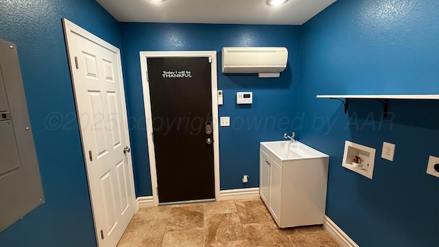 1011 S Lamar St, Amarillo, TX 79102 - laundry area featuring hookup for an electric dryer, a wall unit AC, and hookup for a washing machine
