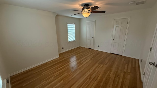 1011 S Lamar St, Amarillo, TX 79102 - unfurnished bedroom featuring wood finished floors and a ceiling fan
