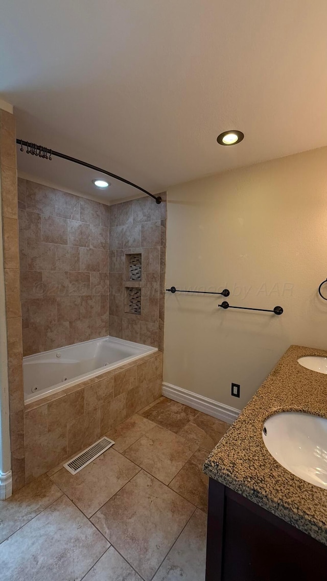 1011 S Lamar St, Amarillo, TX 79102 - full bathroom featuring double vanity, tile patterned flooring, recessed lighting, and a combined bath / shower with jetted tub