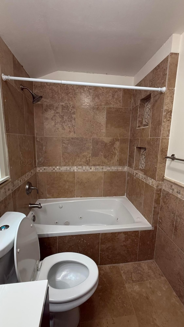 1011 S Lamar St, Amarillo, TX 79102 - bathroom featuring tiled shower / bath, tile walls, and vanity