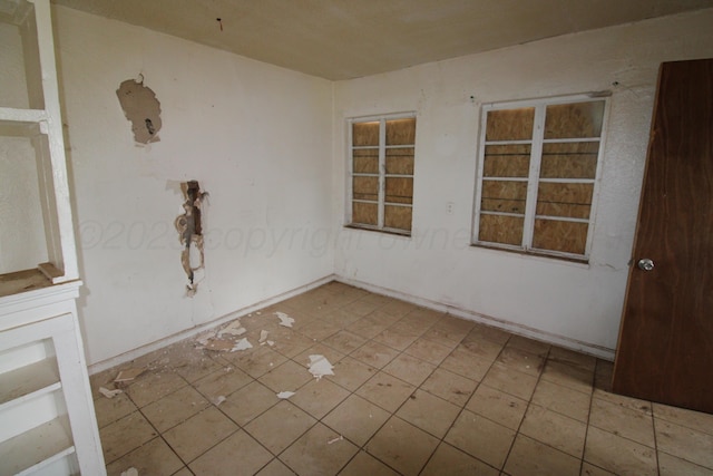 empty room with tile patterned floors