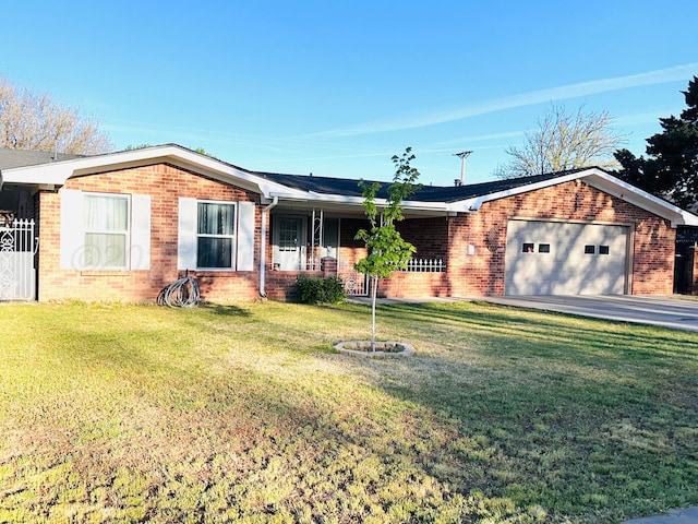 single story home featuring a front lawn, driveway, covered porch, brick siding, and an attached garage