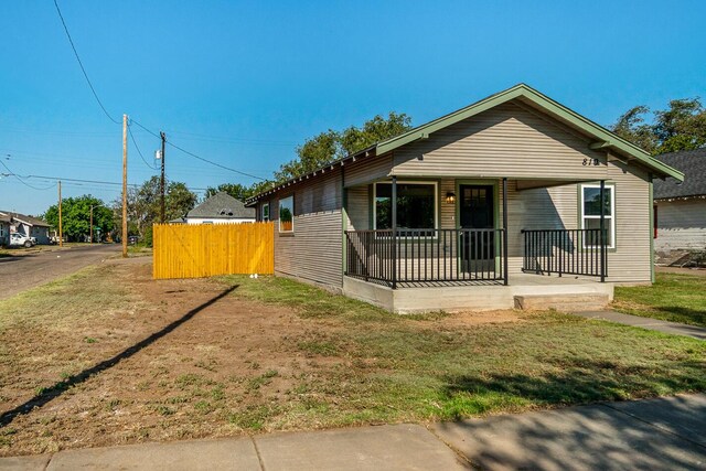 bungalow-style house featuring a front yard and a porch