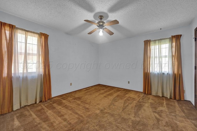 105 Pinehurst St, Borger, TX 79007 - carpeted empty room with plenty of natural light, a textured ceiling, and a ceiling fan