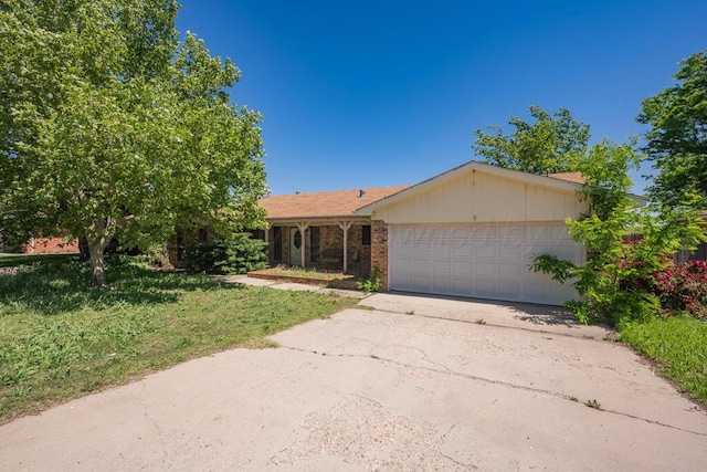 105 Pinehurst St, Borger, TX 79007 - ranch-style house with an attached garage, concrete driveway, and a front yard