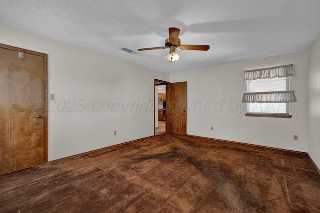105 Pinehurst St, Borger, TX 79007 - spare room with carpet flooring, a ceiling fan, and a textured ceiling