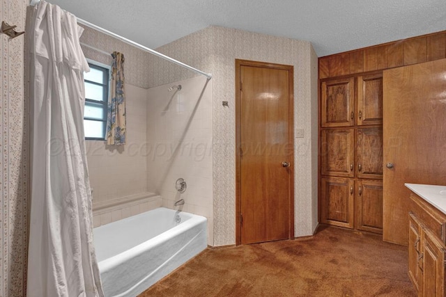 105 Pinehurst St, Borger, TX 79007 - bathroom with shower / bath combo, a textured ceiling, wallpapered walls, and vanity