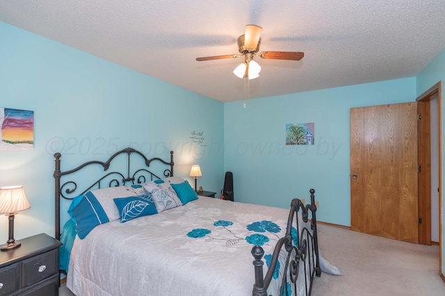 7919 Mitcham Dr, Amarillo, TX 79121 - bedroom with carpet flooring, ceiling fan, and a textured ceiling