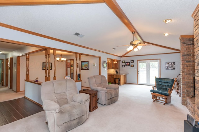 7919 Mitcham Dr, Amarillo, TX 79121 - carpeted living room with a chandelier, a ceiling fan, and crown molding