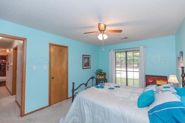7919 Mitcham Dr, Amarillo, TX 79121 - bedroom with light carpet, a textured ceiling, a ceiling fan, and a closet