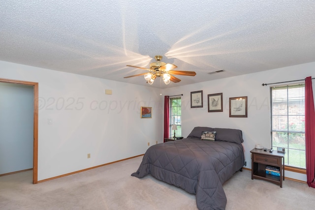 7919 Mitcham Dr, Amarillo, TX 79121 - bedroom with light carpet, a textured ceiling, multiple windows, and ceiling fan