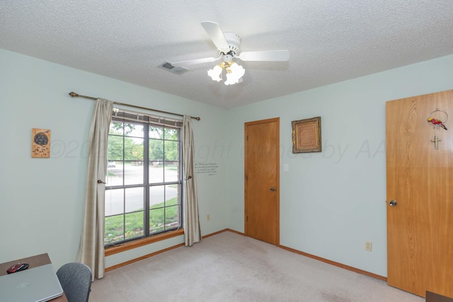 7919 Mitcham Dr, Amarillo, TX 79121 - unfurnished office with light colored carpet, ceiling fan, and a textured ceiling