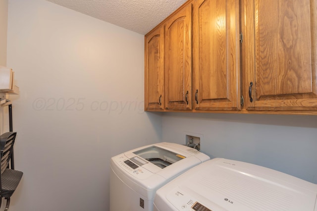 7919 Mitcham Dr, Amarillo, TX 79121 - laundry area featuring separate washer and dryer, cabinet space, and a textured ceiling