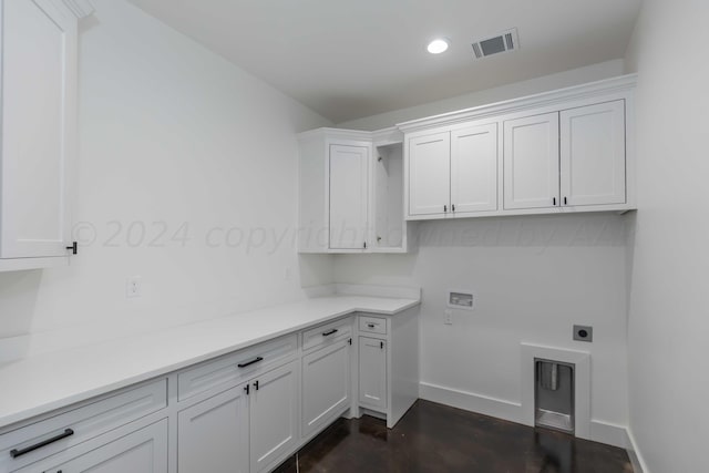 laundry area with washer hookup, cabinets, and electric dryer hookup