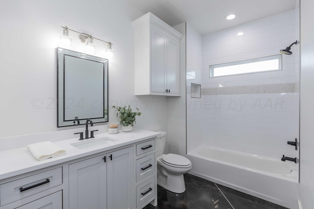 full bathroom with tile patterned flooring, vanity, tiled shower / bath combo, and toilet