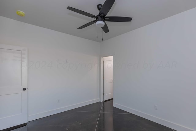 spare room with ceiling fan