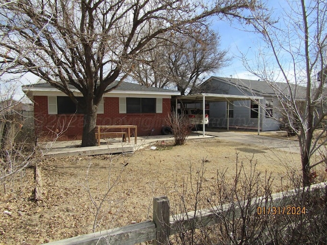 view of front of property with a carport