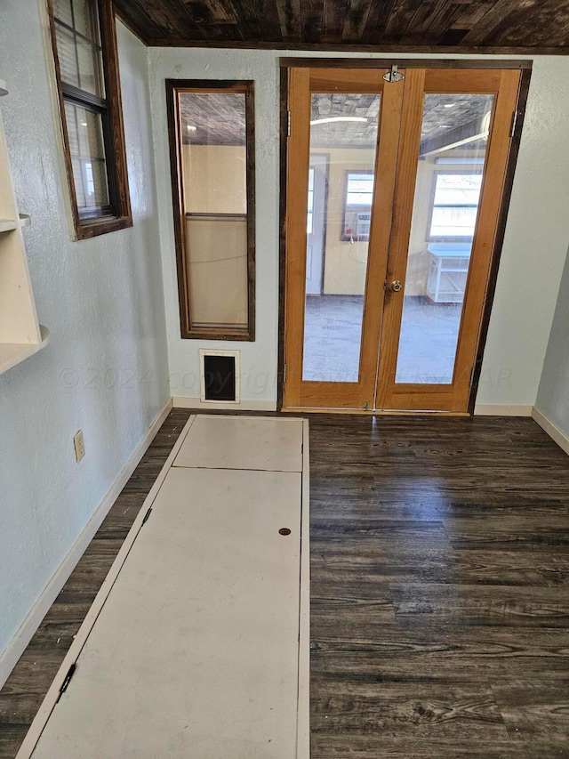 doorway to outside featuring french doors, dark hardwood / wood-style flooring, and wood ceiling