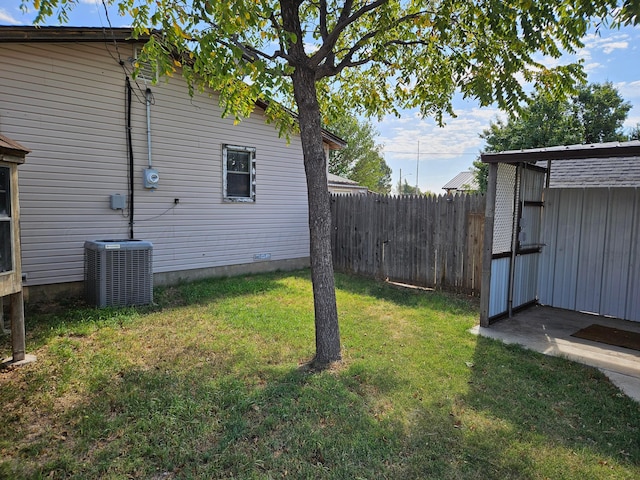 view of yard with central AC