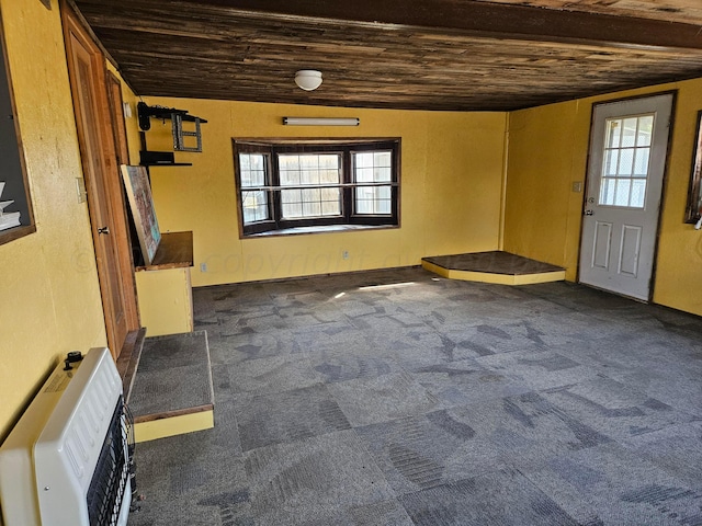 carpeted entryway featuring heating unit and wood ceiling