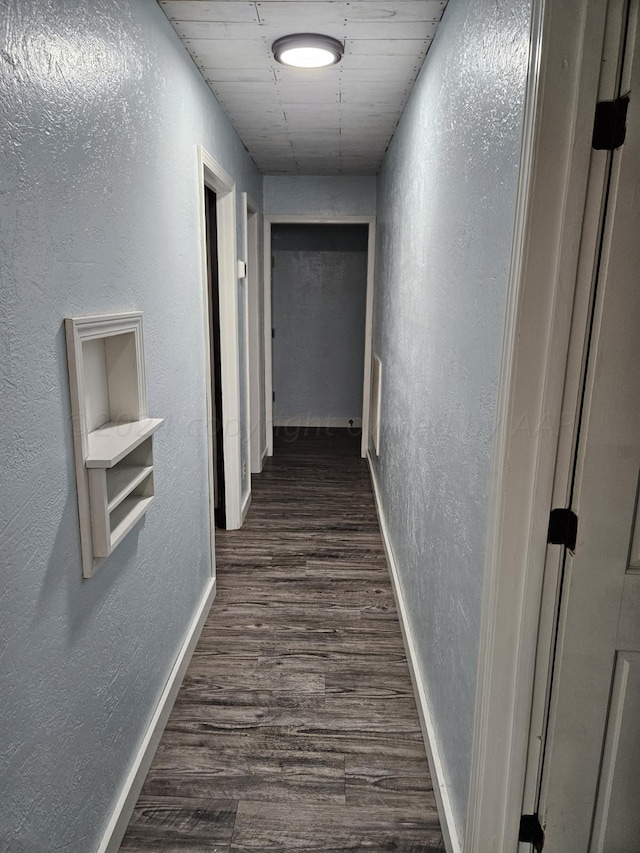 corridor featuring dark hardwood / wood-style floors