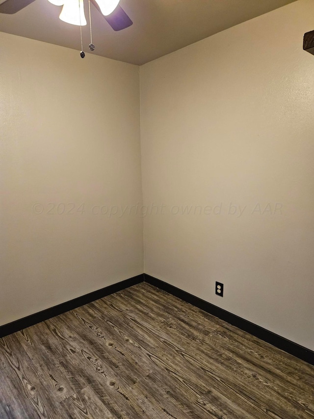 empty room featuring dark hardwood / wood-style floors and ceiling fan