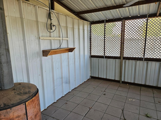 sunroom / solarium featuring lofted ceiling