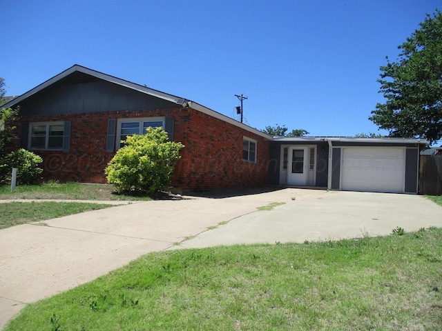 1502 Lancelot St, Borger, TX 79007 - single story home featuring driveway, a garage, and brick siding