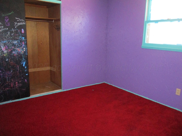 1502 Lancelot St, Borger, TX 79007 - unfurnished bedroom featuring carpet floors and baseboards